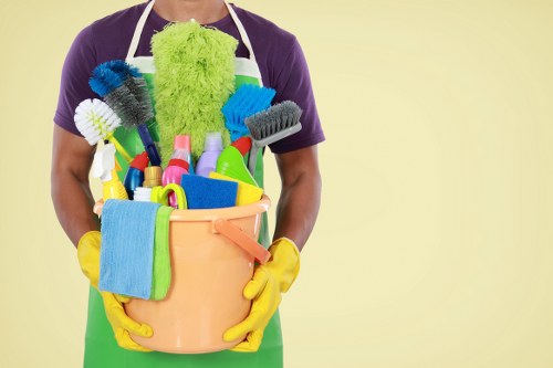 Professional office cleaners working in a Westminster workspace