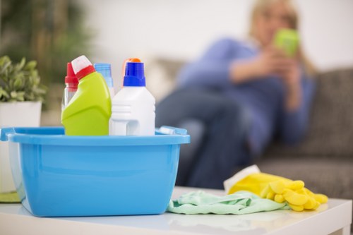 Cleaner checking emergency response procedures in a service area